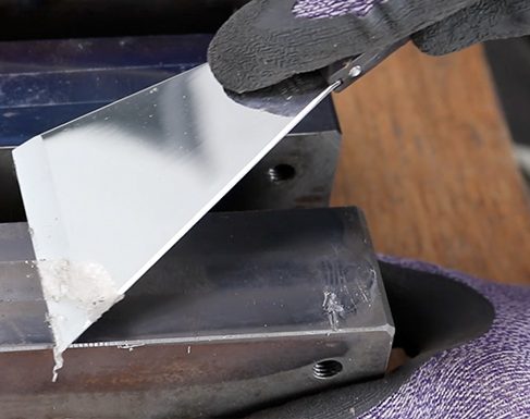 Nisaku stainless steel scraper at work